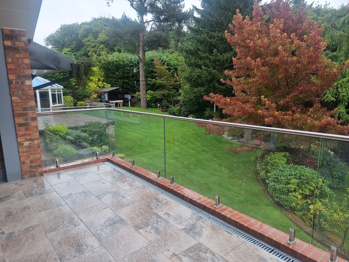 Stand-off glass on a brick terrace in Disley — further view of the completed installation