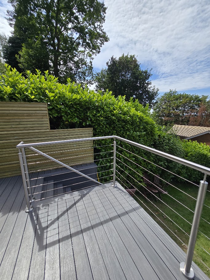 Stainless steel wire rope balustrade on a raised garden deck — further view of the completed installation