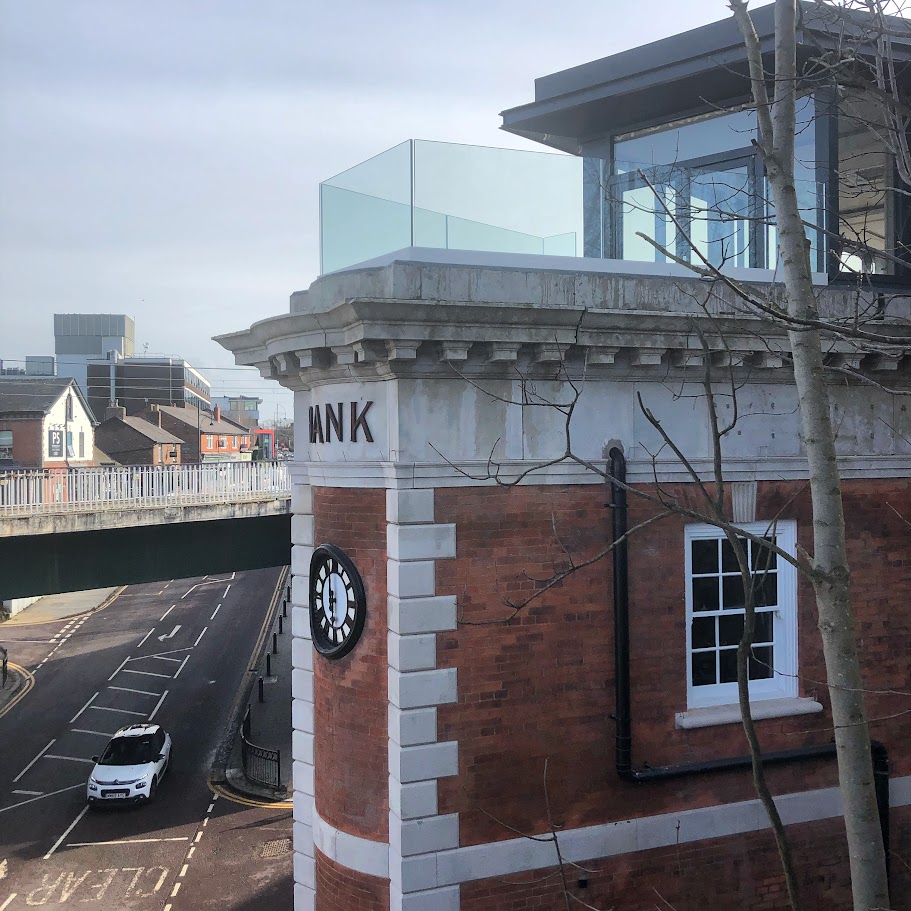 A rooftop terrace above a converted bank — further view of the completed installation
