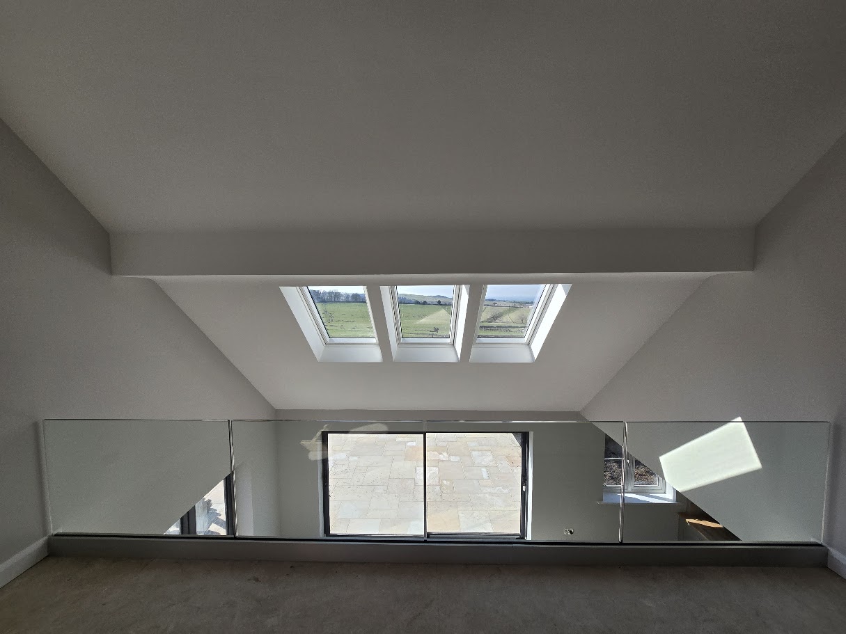 Frameless glass mezzanine in a vaulted Cheshire home — further view of the completed installation