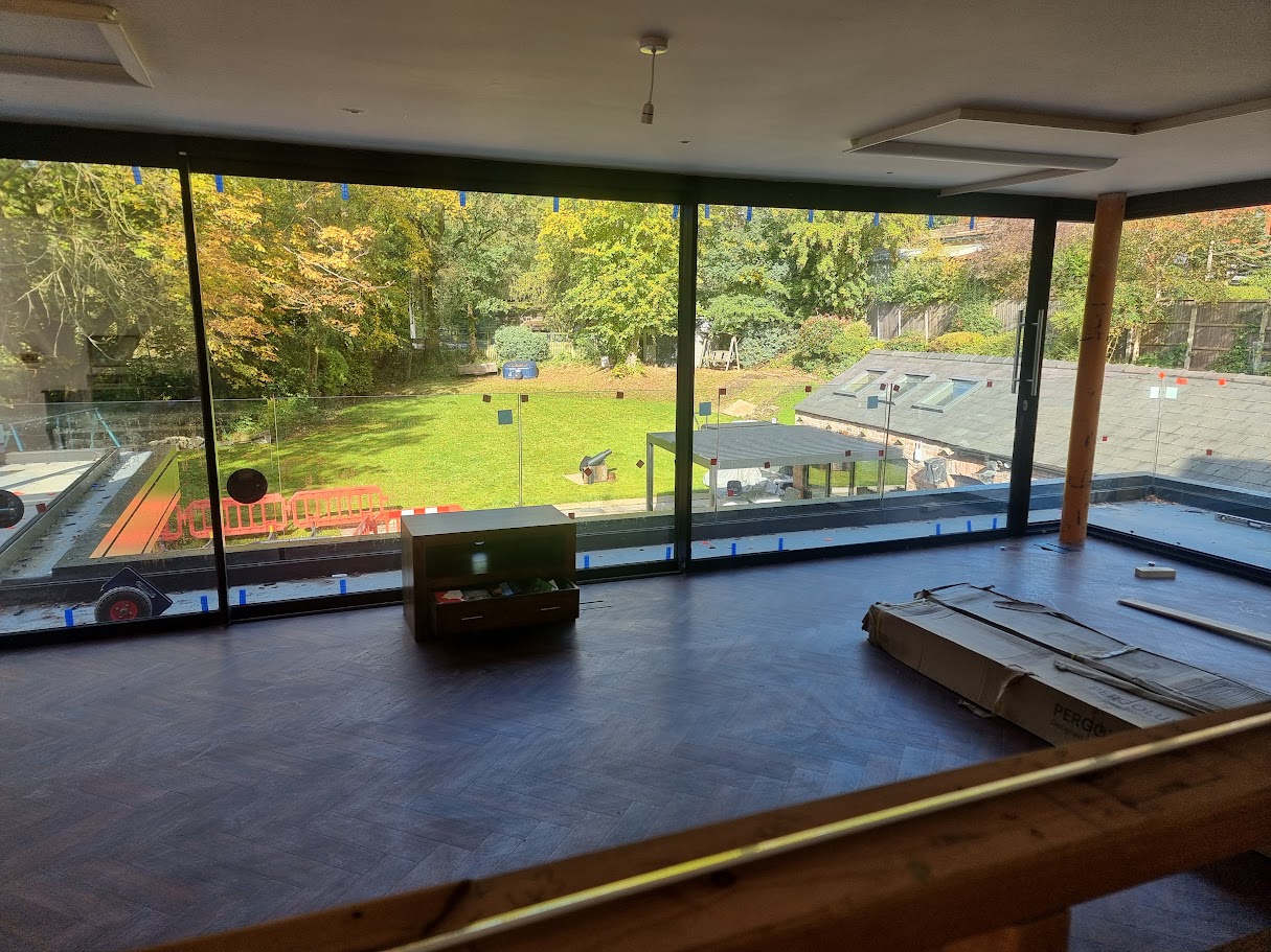 Frameless glass terraces on a Victorian villa extension — further view of the completed installation