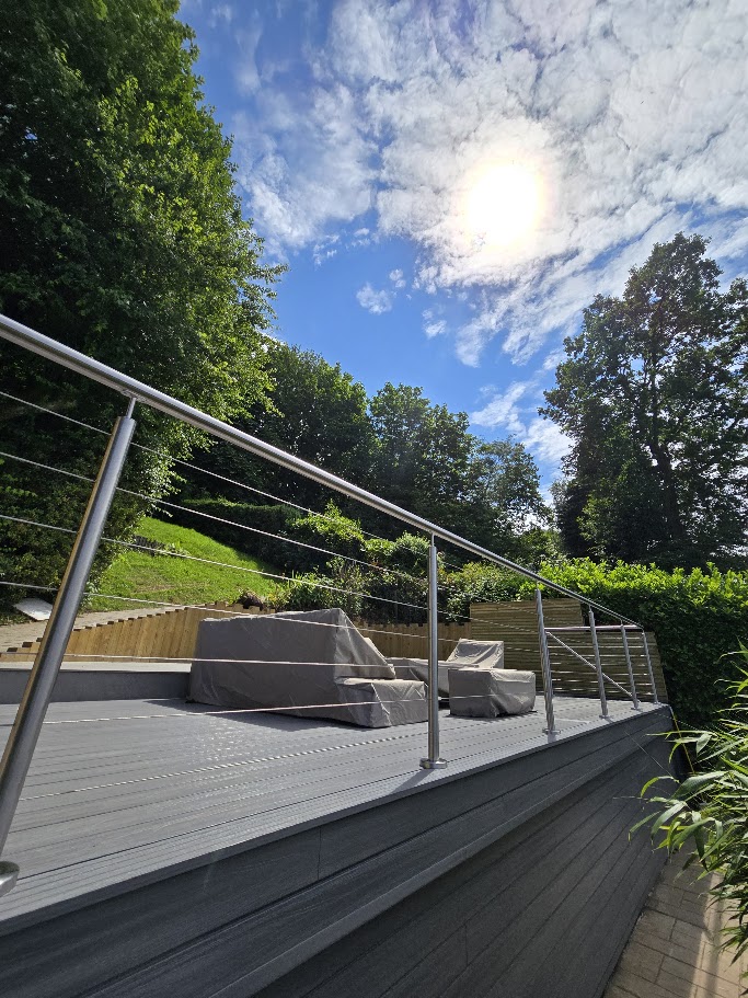 Stainless steel wire rope balustrade on a raised garden deck — further view of the completed installation