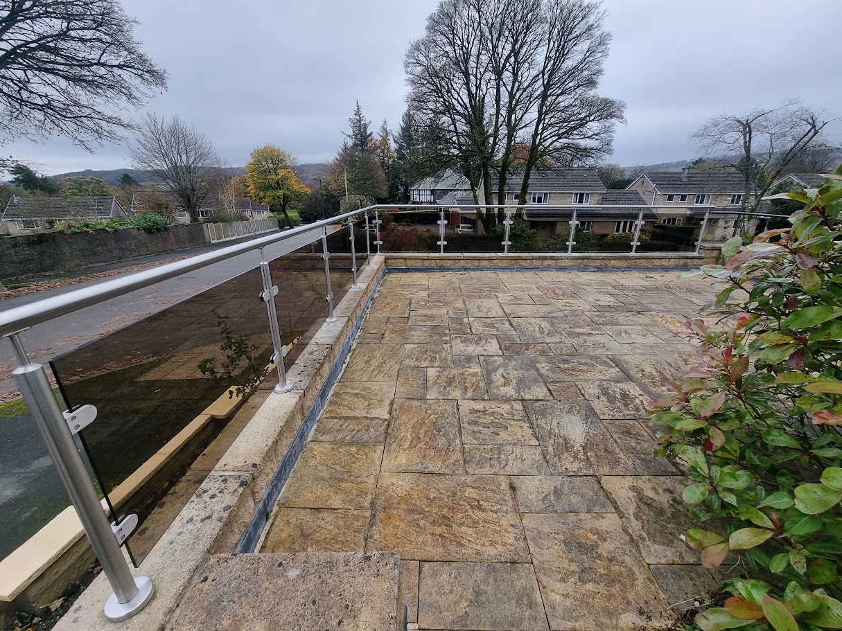 Bronze glass balustrades on stone terraces in Buxton — further view of the completed installation