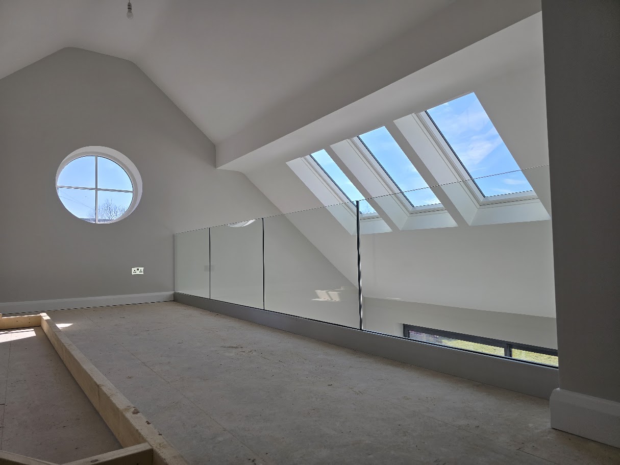 Frameless glass mezzanine in a vaulted Cheshire home — further view of the completed installation