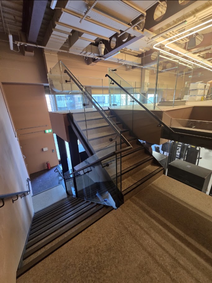 Frameless glass mezzanine and stair balustrades — further view of the completed installation
