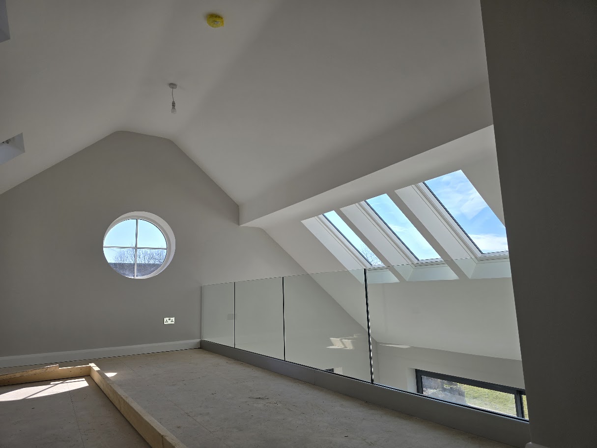 Frameless glass mezzanine in a vaulted Cheshire home — further view of the completed installation