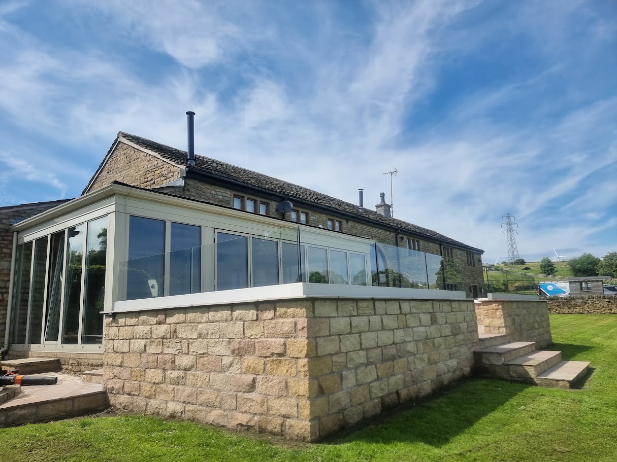 Frameless glass on a stone-walled terrace in Lymm — further view of the completed installation