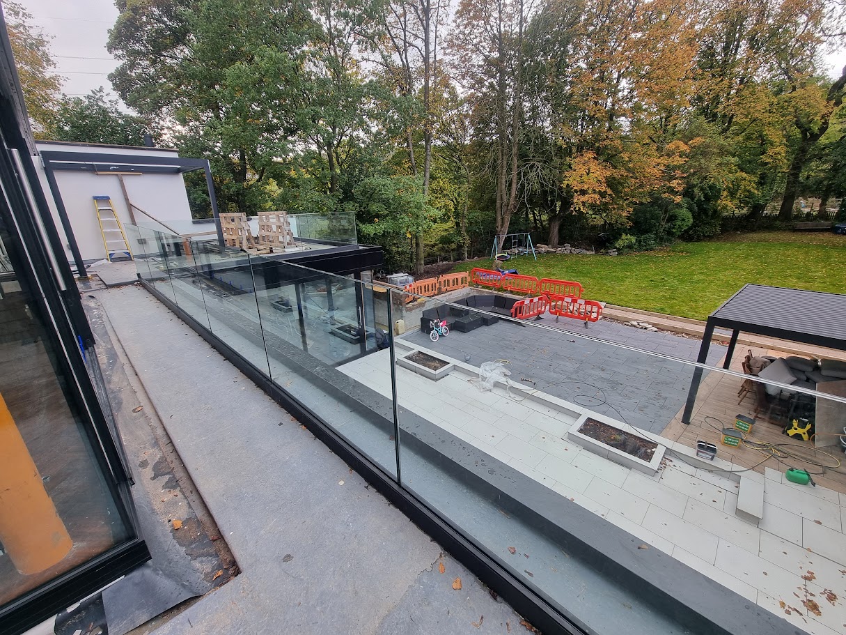Frameless glass terraces on a Victorian villa extension — further view of the completed installation