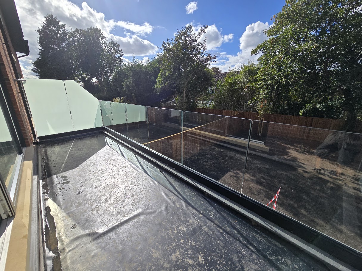 Frameless glass terrace balustrade on a new-build home — further view of the completed installation