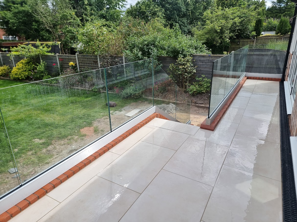Frameless glass on a raised terrace in Bramhall — Manchester Balustrades installation