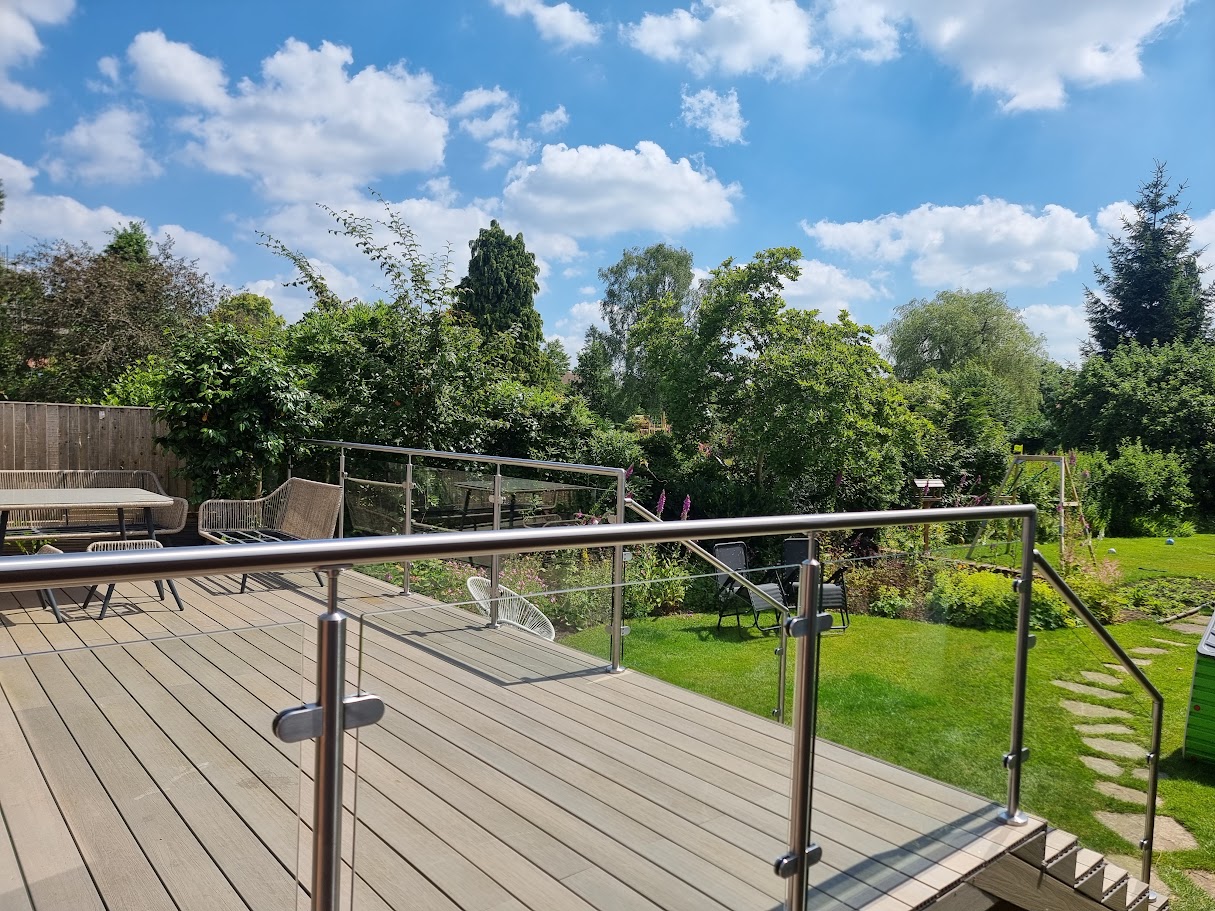 A stainless post glass balustrade on a Hale garden deck — further view of the completed installation
