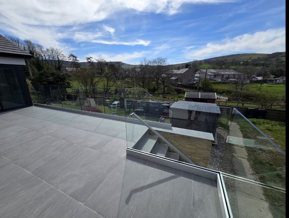 Frameless glass terrace on a hillside bungalow — further view of the completed installation
