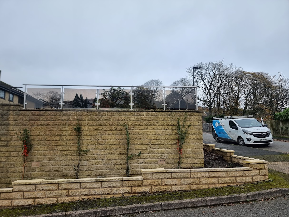 Bronze glass balustrades on stone terraces in Buxton — further view of the completed installation