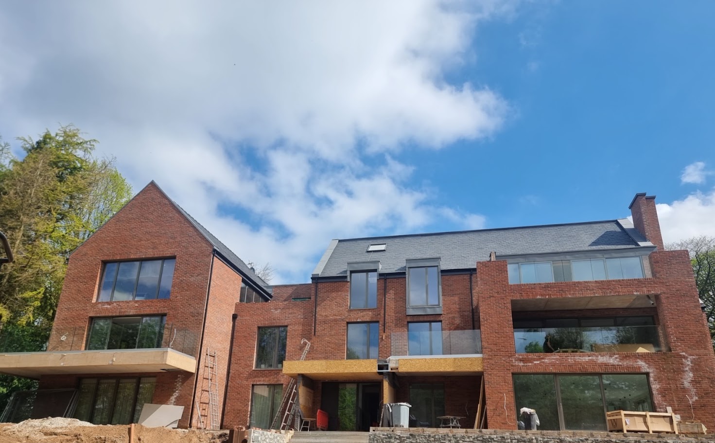 Frameless glass balconies at a contemporary Prestbury home — Manchester Balustrades installation
