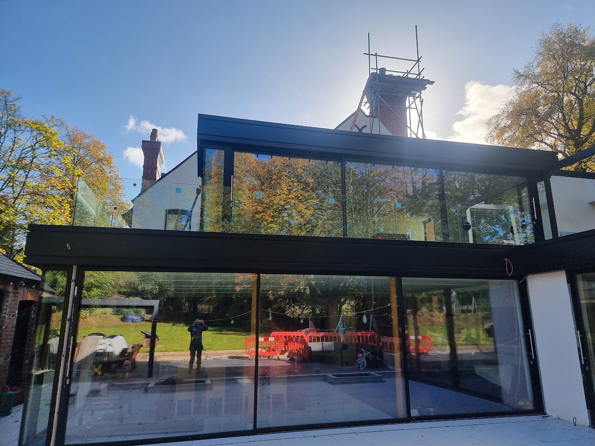 Frameless glass terraces on a Victorian villa extension — further view of the completed installation