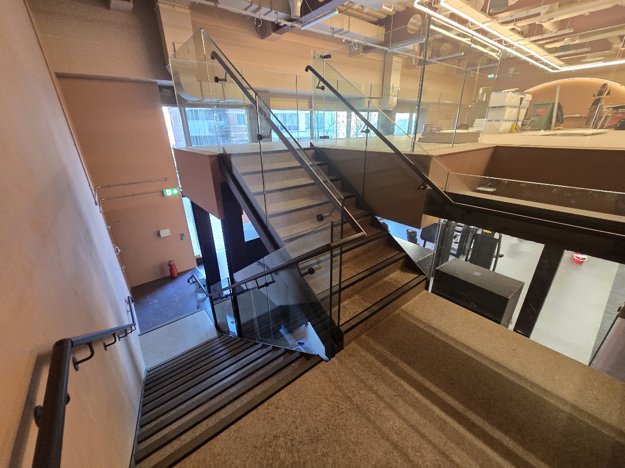 Frameless glass mezzanine and stair balustrades — further view of the completed installation