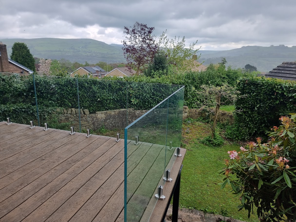 A stand-off glass balustrade on a raised deck in Whaley Bridge — Manchester Balustrades installation
