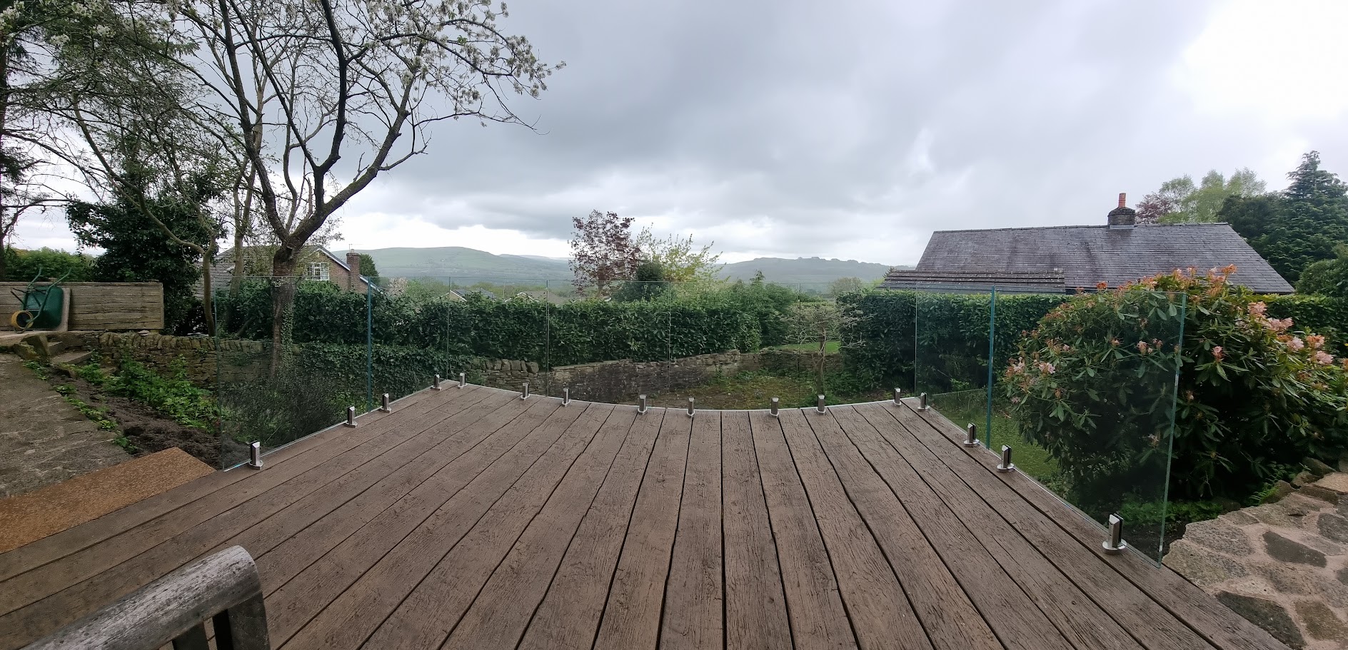 A stand-off glass balustrade on a raised deck in Whaley Bridge — further view of the completed installation
