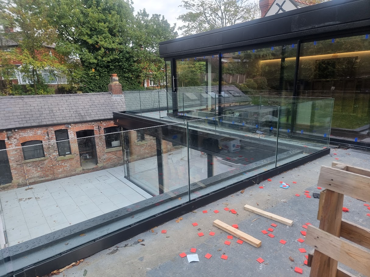 Frameless glass terraces on a Victorian villa extension — further view of the completed installation