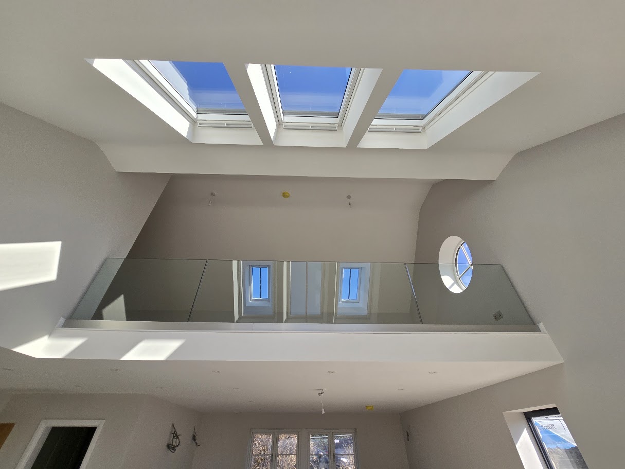 Frameless glass mezzanine in a vaulted Cheshire home — Manchester Balustrades installation