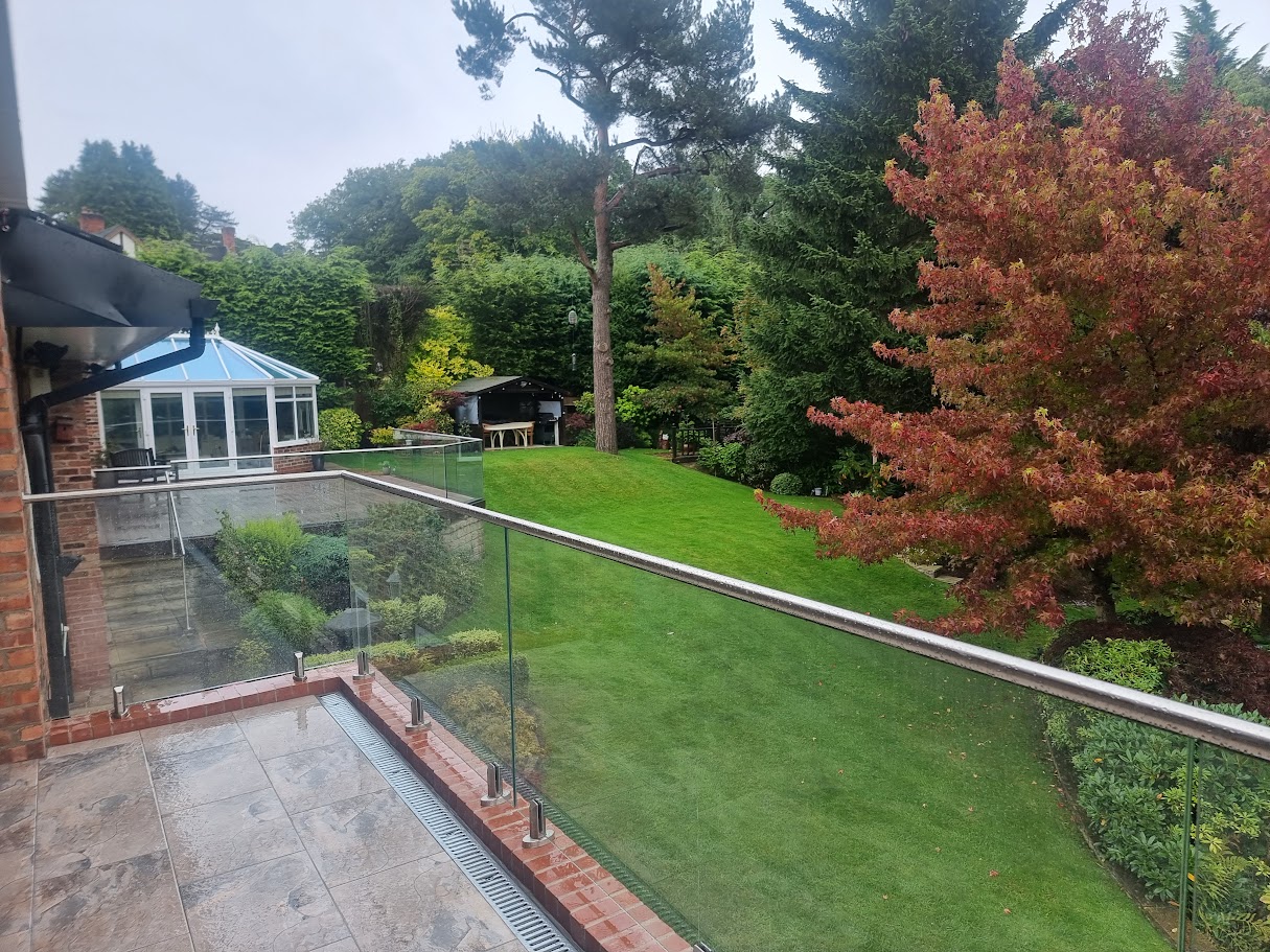 Stand-off glass on a brick terrace in Disley — further view of the completed installation