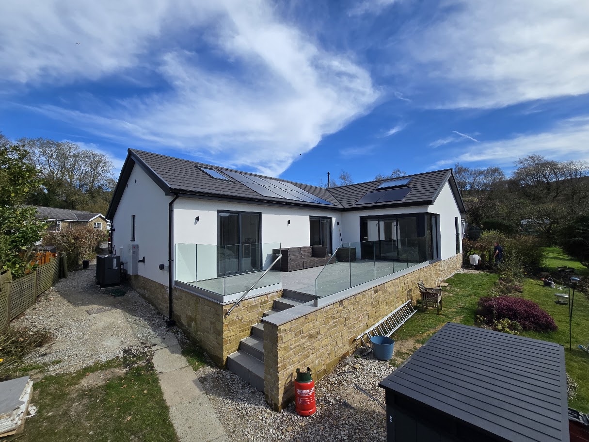Frameless glass terrace on a hillside bungalow — Manchester Balustrades installation