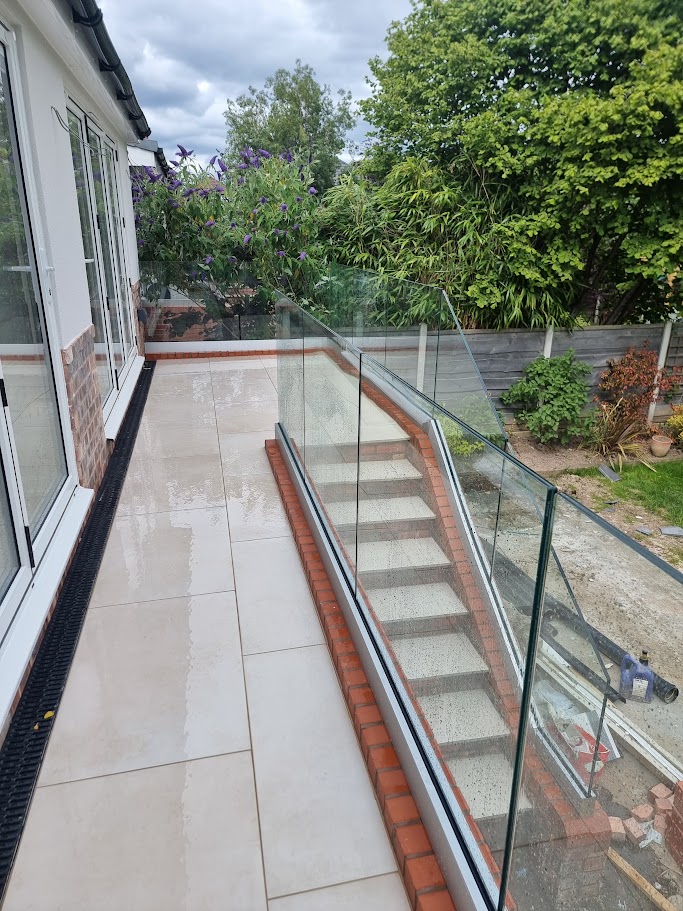 Frameless glass on a raised terrace in Bramhall — further view of the completed installation