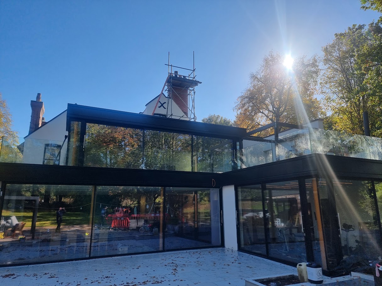 Frameless glass terraces on a Victorian villa extension — further view of the completed installation