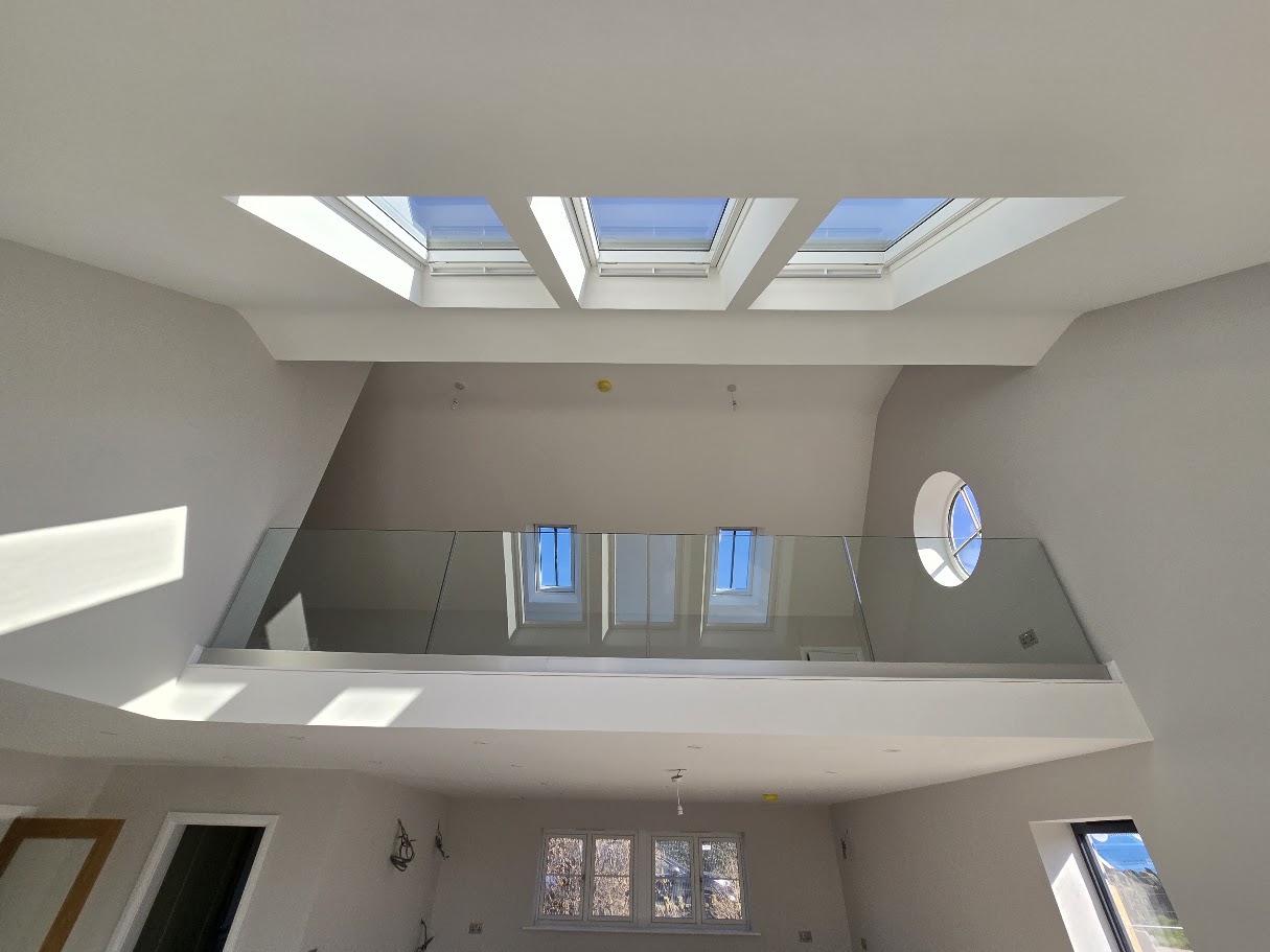 Frameless glass mezzanine in a vaulted Cheshire home — further view of the completed installation