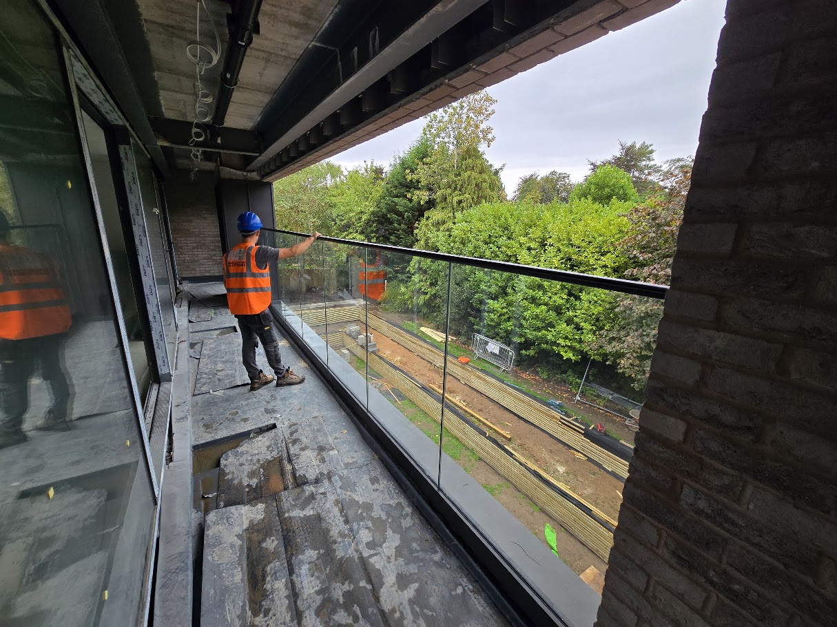 Frameless glass balcony on a new-build home — further view of the completed installation