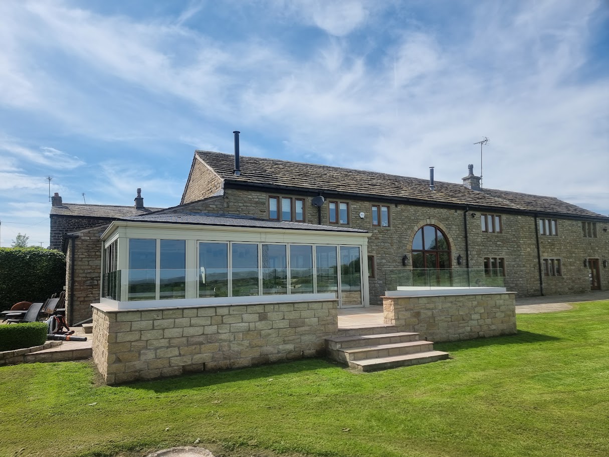 Frameless glass on a stone-walled terrace in Lymm — further view of the completed installation