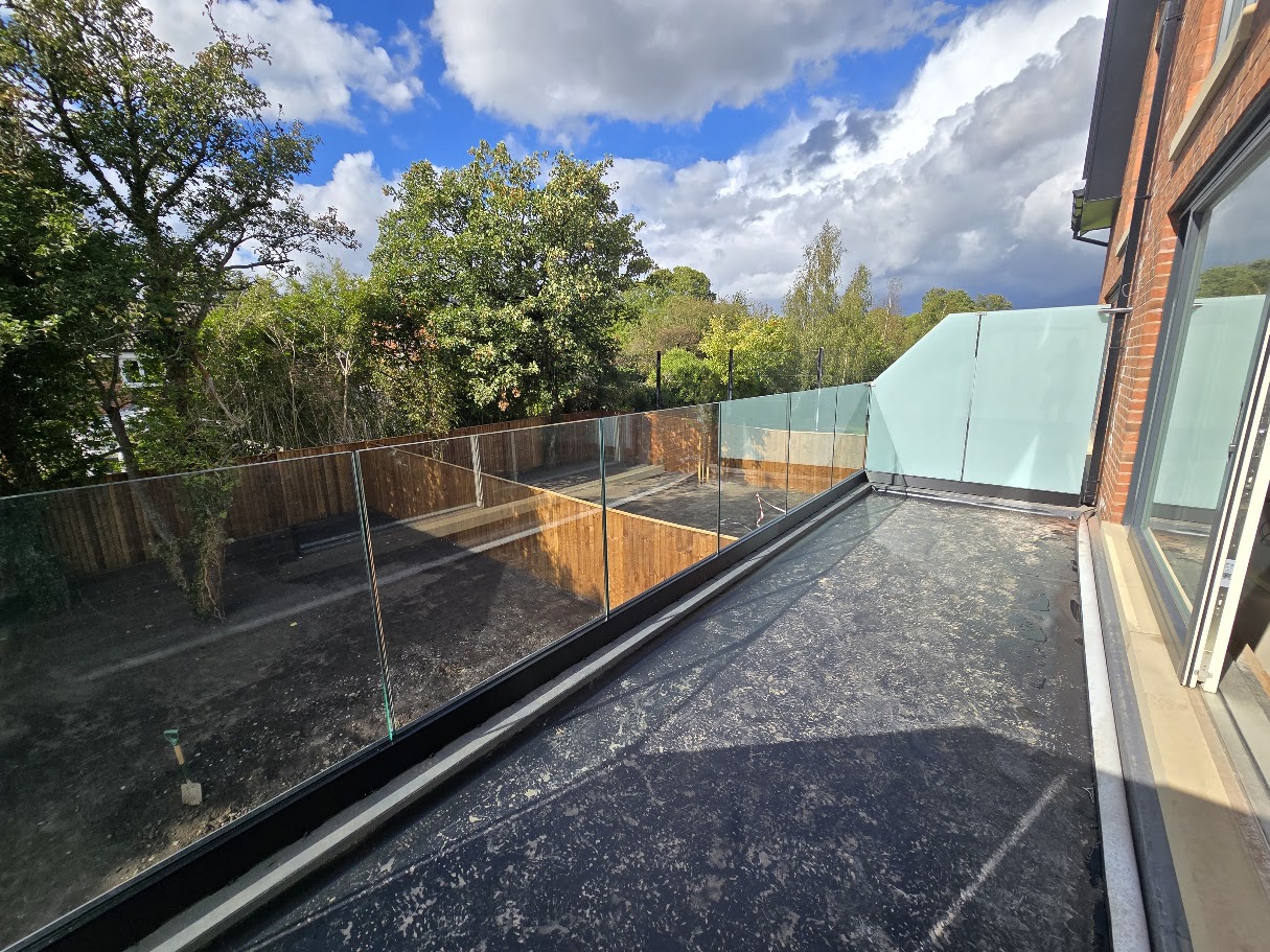 Frameless glass terrace balustrade on a new-build home — further view of the completed installation