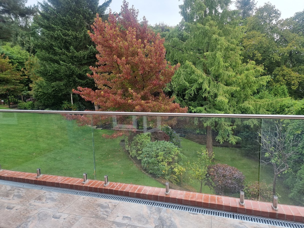 Stand-off glass on a brick terrace in Disley — further view of the completed installation