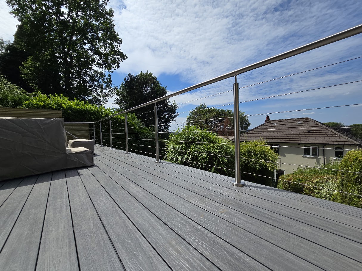 Stainless steel wire rope balustrade on a raised garden deck — further view of the completed installation