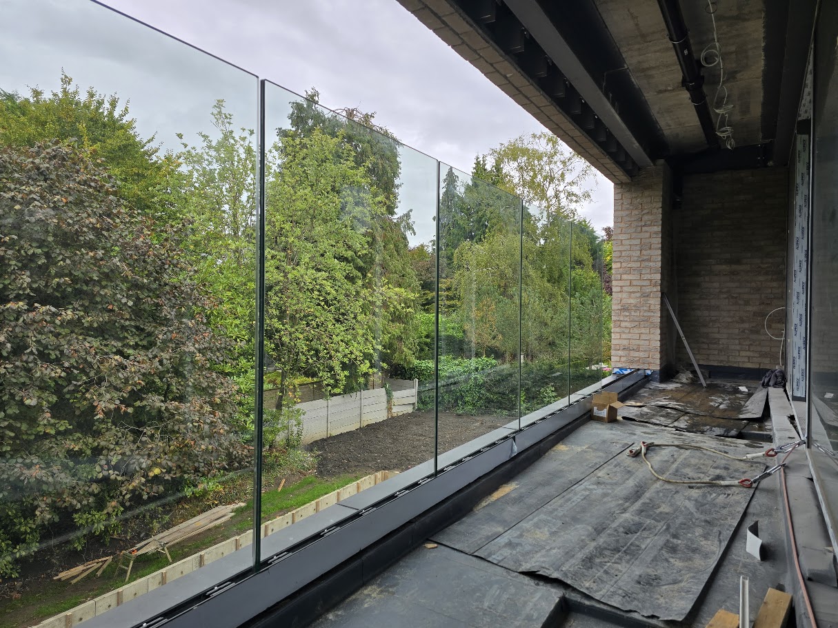 Frameless glass balcony on a new-build home — further view of the completed installation