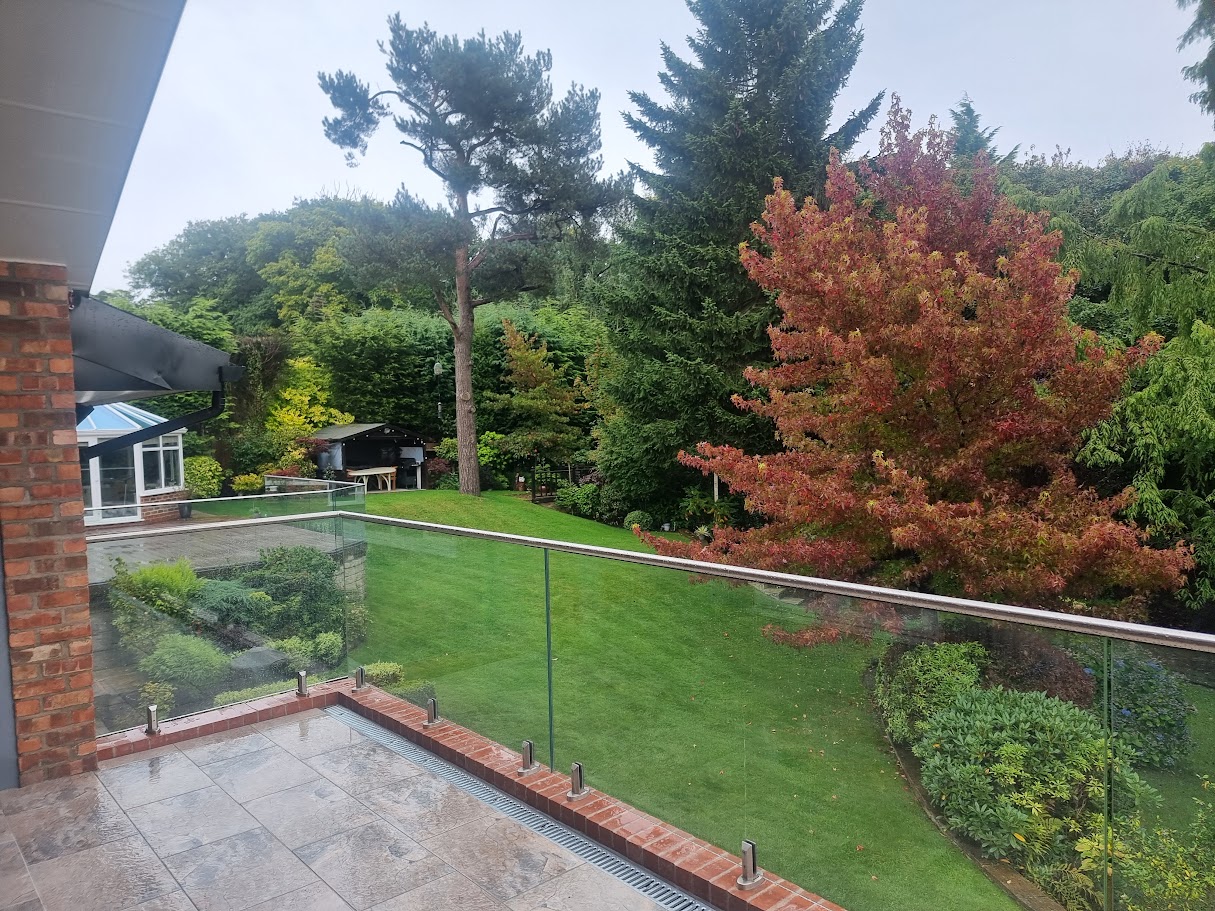 Stand-off glass on a brick terrace in Disley — further view of the completed installation