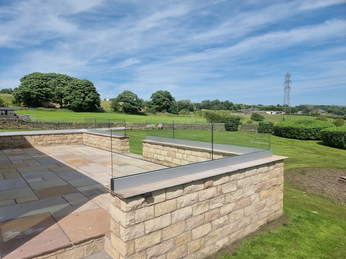 Frameless glass on a stone-walled terrace in Lymm — further view of the completed installation