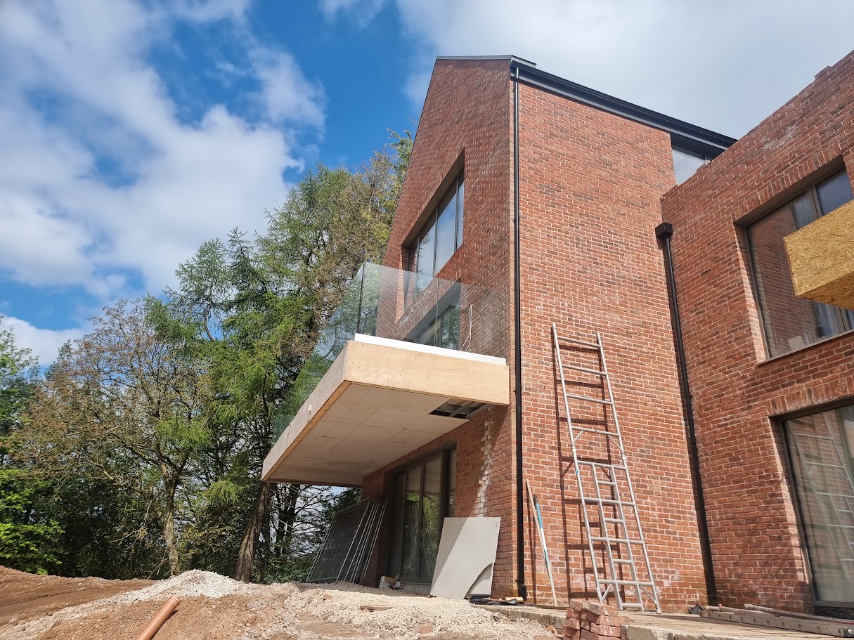 Frameless glass balconies at a contemporary Prestbury home — further view of the completed installation