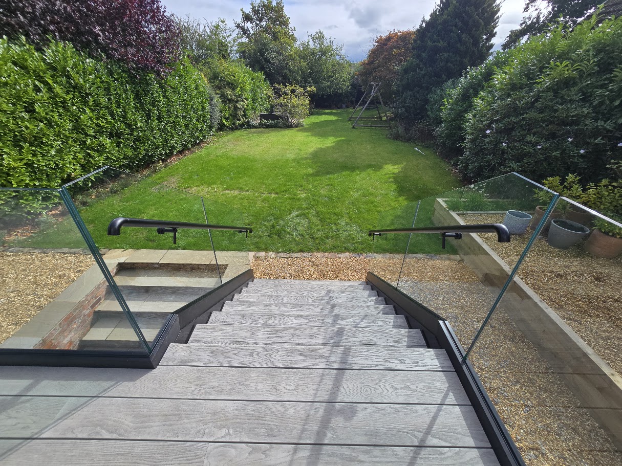 Frameless glass terrace and external staircase — further view of the completed installation