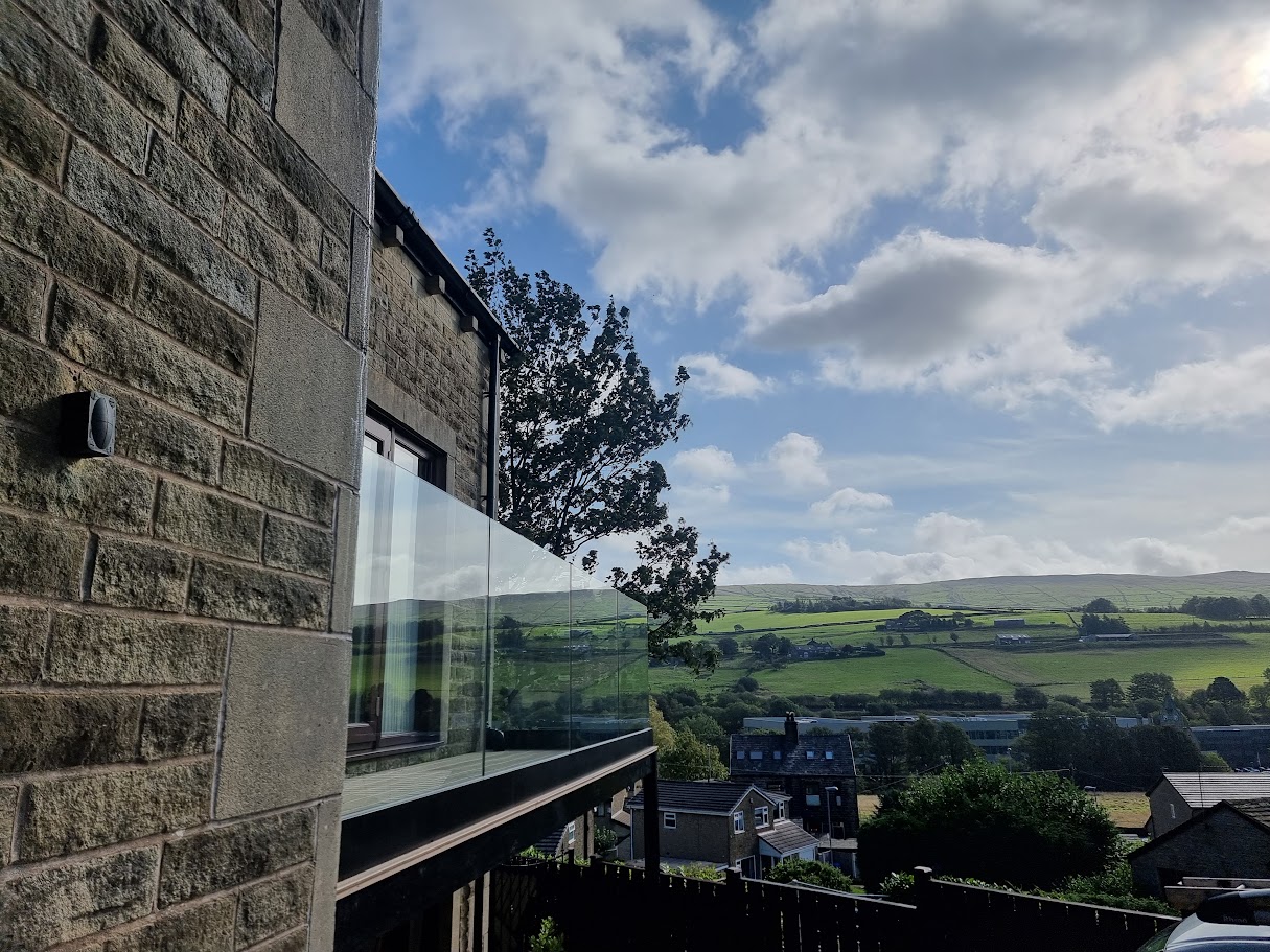 A frameless glass balcony in Mossley — further view of the completed installation