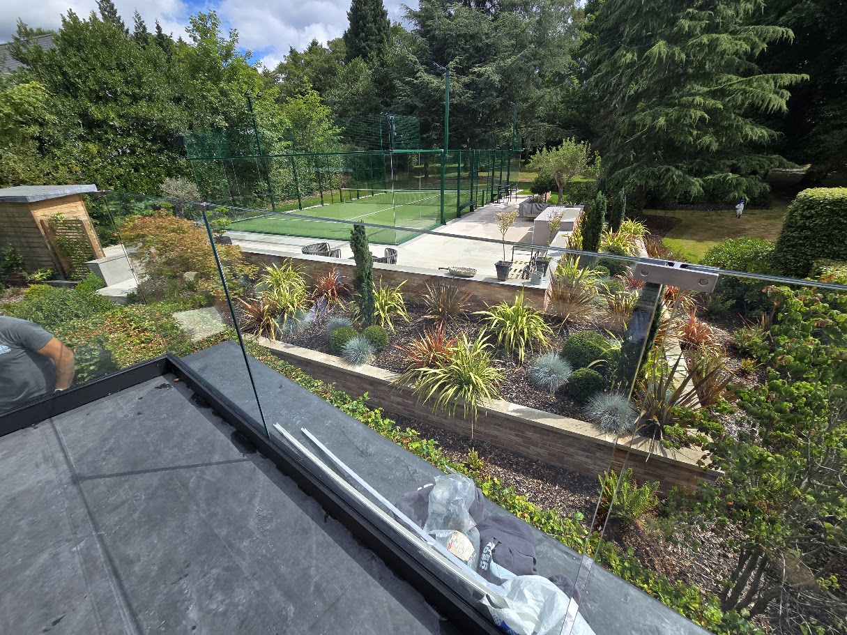 Frameless glass balustrade on a country house roof terrace — further view of the completed installation