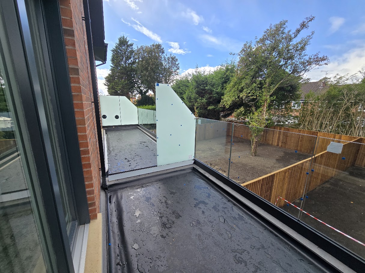 Frameless glass terrace balustrade on a new-build home — further view of the completed installation