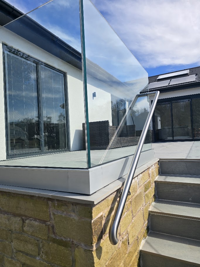 Frameless glass terrace on a hillside bungalow — further view of the completed installation