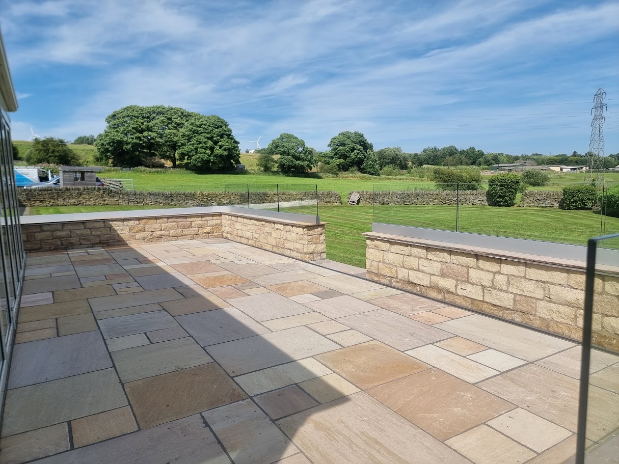 Frameless glass on a stone-walled terrace in Lymm — further view of the completed installation