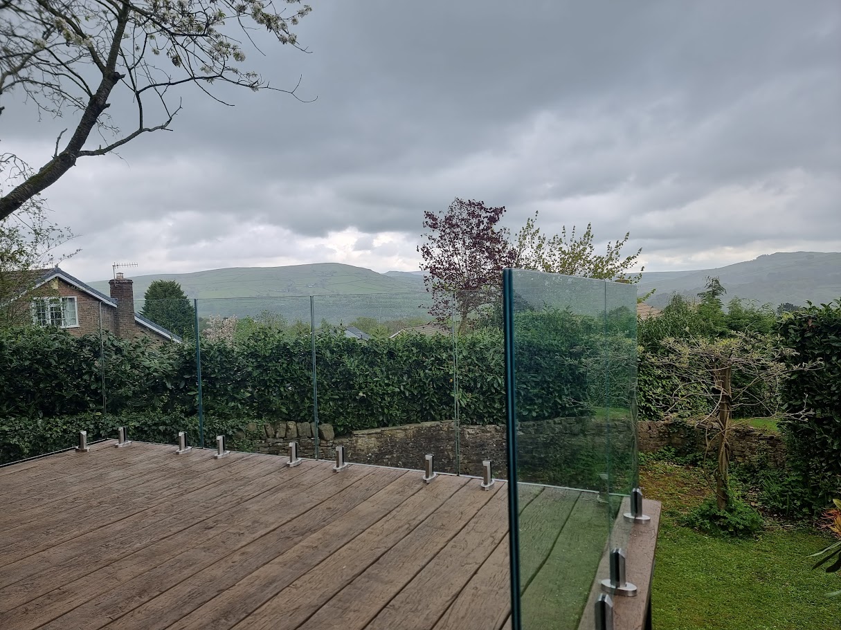 A stand-off glass balustrade on a raised deck in Whaley Bridge — further view of the completed installation