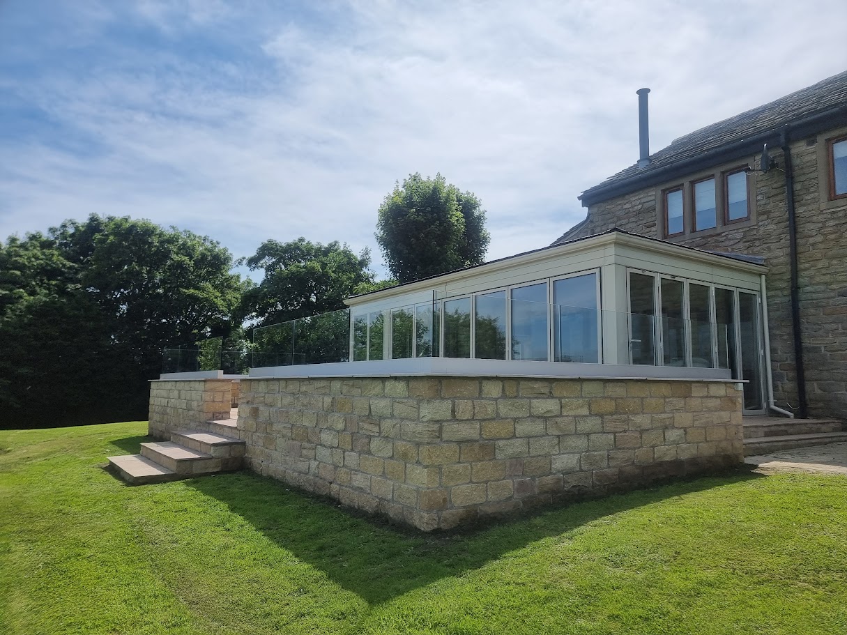 Frameless glass on a stone-walled terrace in Lymm — further view of the completed installation