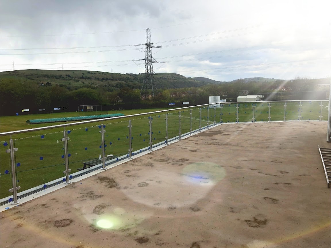 Post-and-glass balustrades at Stayley Cricket Club — further view of the completed installation