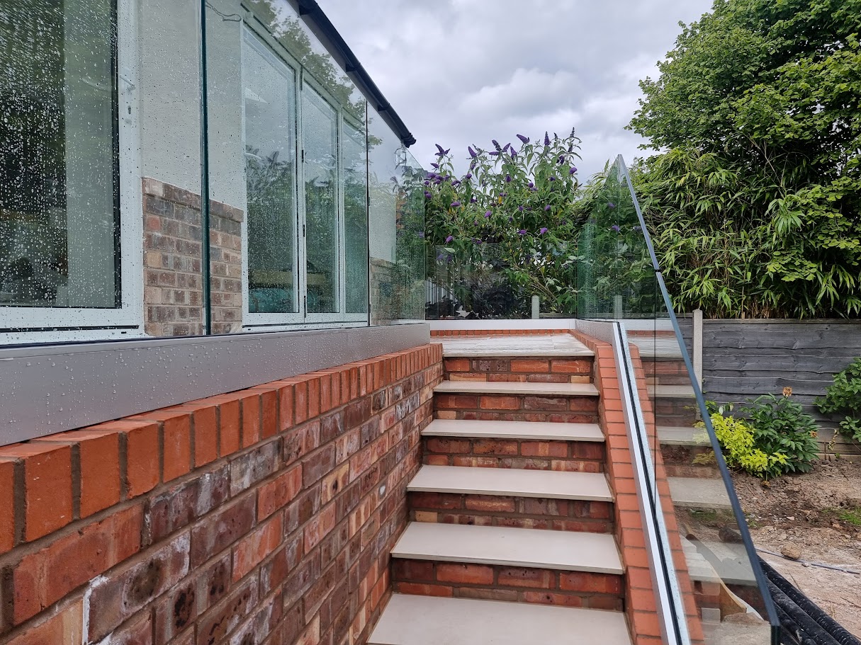 Frameless glass on a raised terrace in Bramhall — further view of the completed installation