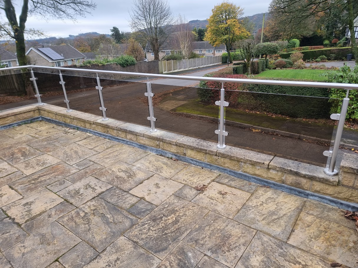 Bronze glass balustrades on stone terraces in Buxton — further view of the completed installation