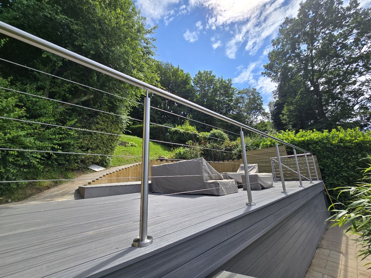 Stainless steel wire rope balustrade on a raised garden deck — further view of the completed installation